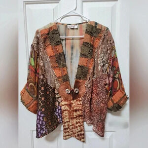 Artsy top, gorgeous colors/fabrics, dress up/down, great for travel, versatile